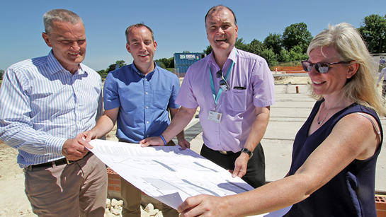 Pelham Team Members Look At Site Plan